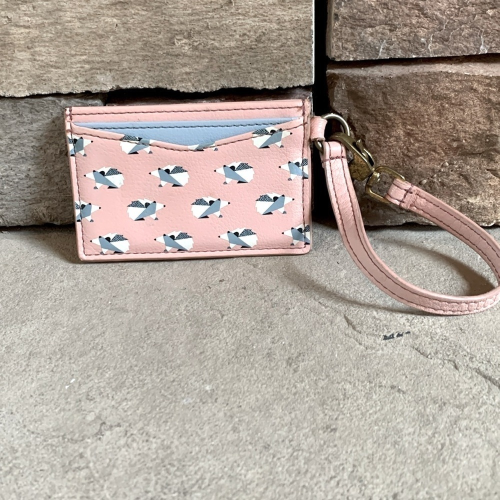 Fossil pink and blue card holder wristlet with hedgehog design